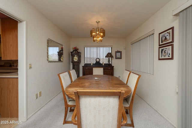 1147 Pedro Ct, Rio Rico, AZ 85648 - carpeted dining space featuring a chandelier and baseboards