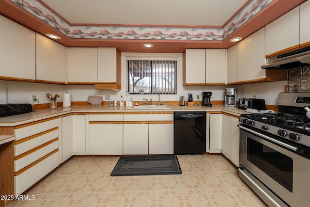 1147 Pedro Ct, Rio Rico, AZ 85648 - kitchen with stainless steel gas stove, black dishwasher, a sink, light countertops, and recessed lighting