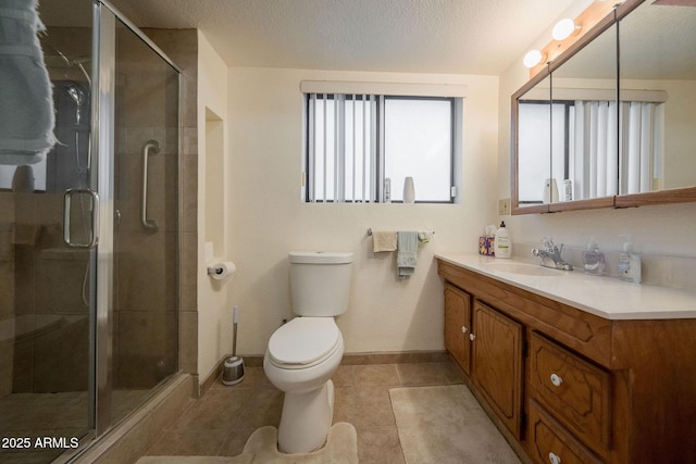 1147 Pedro Ct, Rio Rico, AZ 85648 - bathroom with vanity, toilet, a stall shower, baseboards, and tile patterned floors