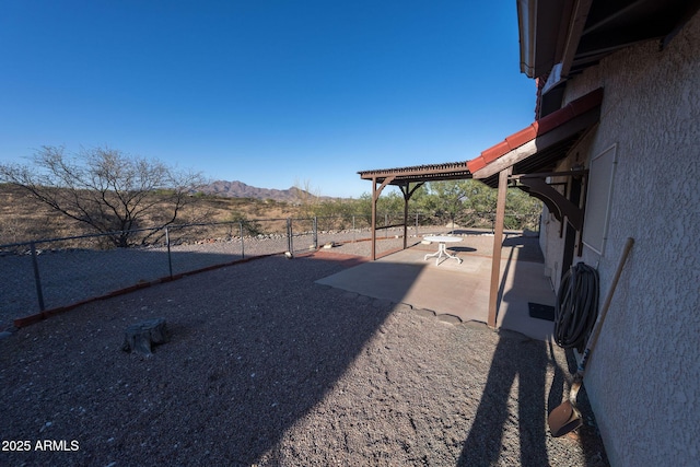 1147 Pedro Ct, Rio Rico, AZ 85648 - fenced backyard with a mountain view and a patio area