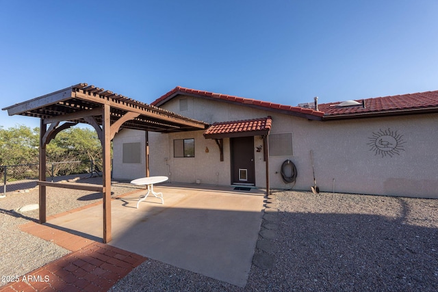 1147 Pedro Ct, Rio Rico, AZ 85648 - view of front facade featuring a pergola, stucco siding, a patio area, and a tile roof