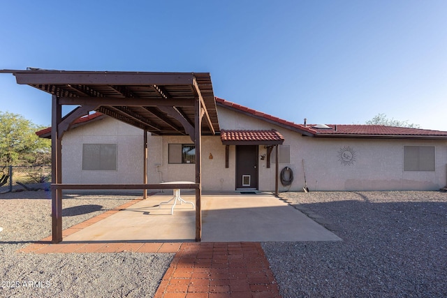 1147 Pedro Ct, Rio Rico, AZ 85648 - rear view of property with stucco siding, a tile roof, and a patio