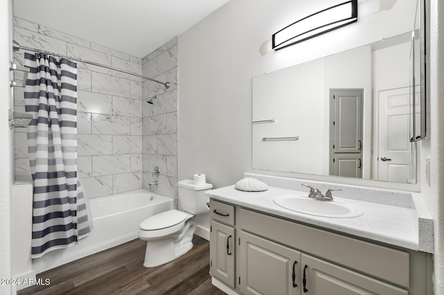 full bathroom featuring hardwood / wood-style flooring, vanity, toilet, and shower / bath combo