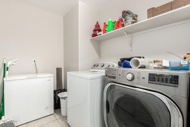 36480 W El Greco St, Maricopa, AZ 85138 - clothes washing area with light tile patterned floors, separate washer and dryer, and laundry area