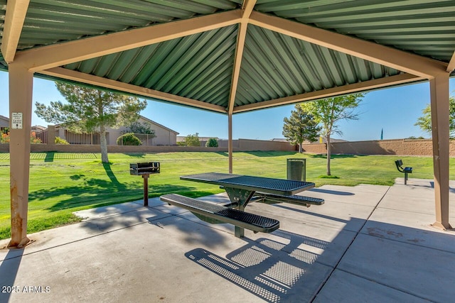 36480 W El Greco St, Maricopa, AZ 85138 - view of community with fence, a yard, and a patio area