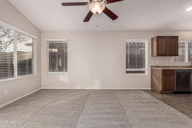 kitchen featuring dishwasher, dark brown cabinetry, ceiling fan, and lofted ceiling