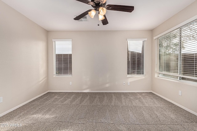 empty room with carpet and ceiling fan