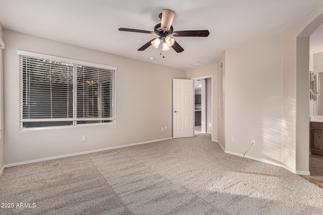 empty room with carpet flooring and ceiling fan