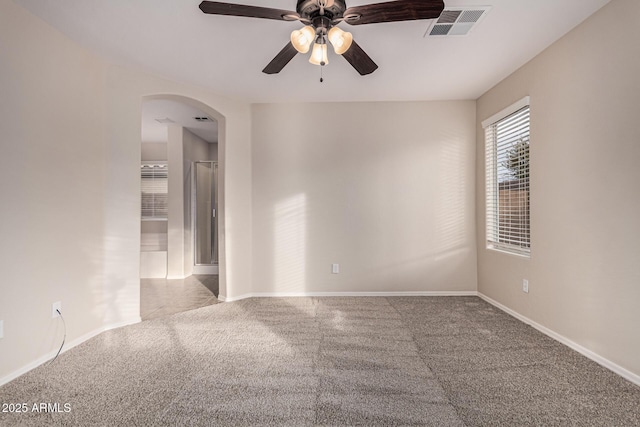 carpeted empty room with ceiling fan