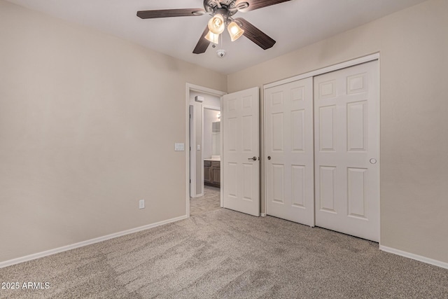 unfurnished bedroom with ceiling fan, a closet, and light carpet