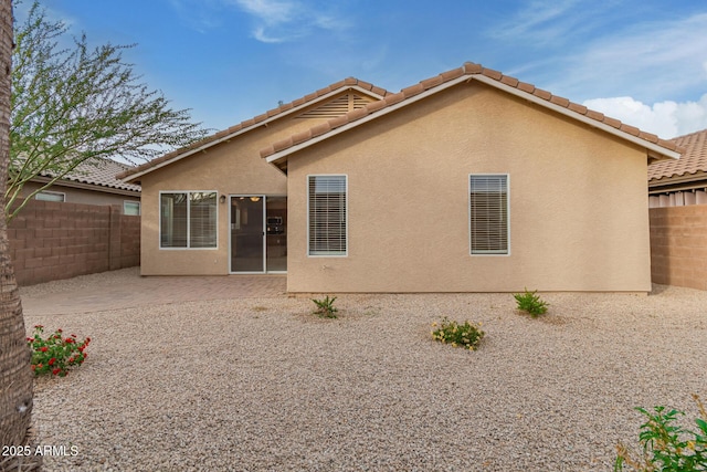 rear view of house with a patio area