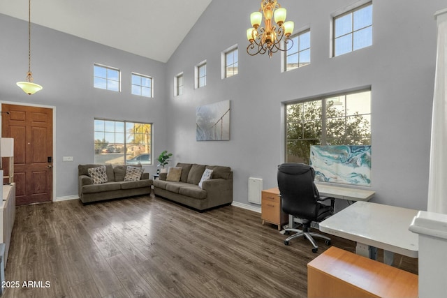 office featuring dark wood-type flooring, a chandelier, and high vaulted ceiling