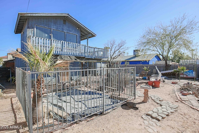 back of house with a patio