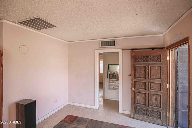 foyer entrance with a textured ceiling