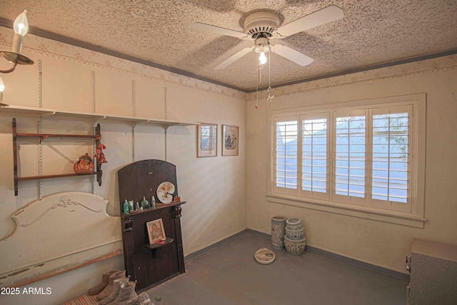 miscellaneous room featuring a textured ceiling and ceiling fan