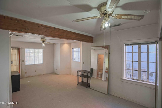 unfurnished room with a healthy amount of sunlight and light colored carpet