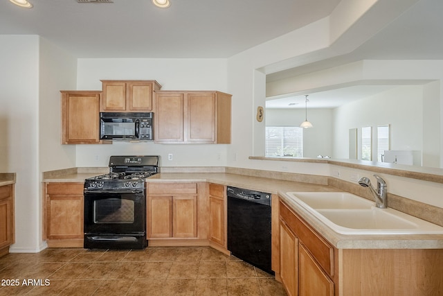 kitchen featuring light tile patterned floors, sink, hanging light fixtures, and black appliances