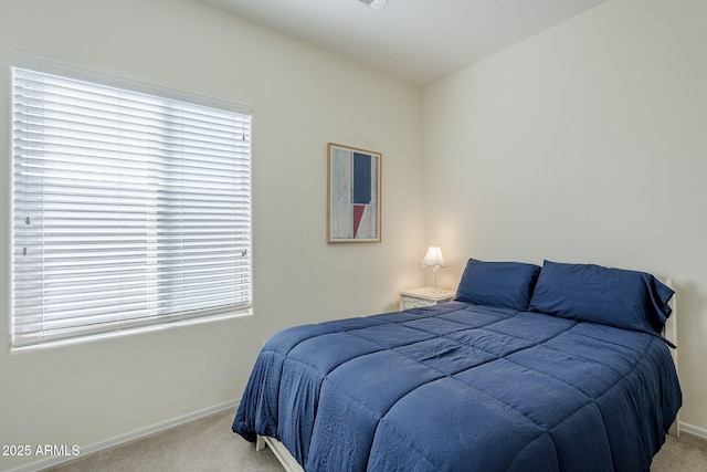 bedroom featuring light carpet