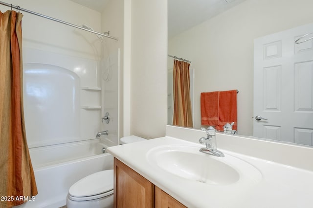 full bathroom featuring shower / bath combo, vanity, and toilet