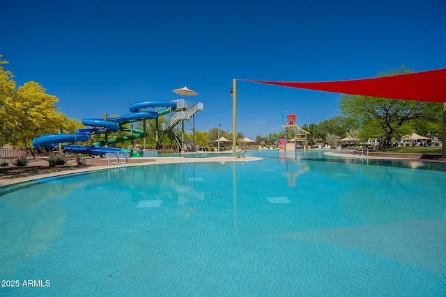 view of pool featuring a water slide