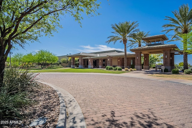 view of property's community with a yard and a gazebo