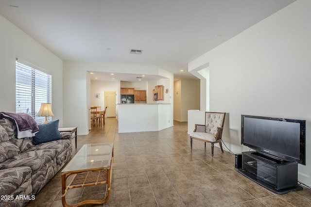 living room with light tile patterned flooring