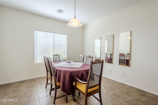 dining room with tile patterned floors