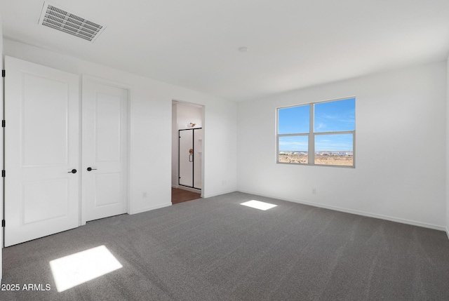 4106 W Eli Dr, San Tan Valley, AZ 85144 - unfurnished bedroom featuring baseboards, visible vents, and dark colored carpet