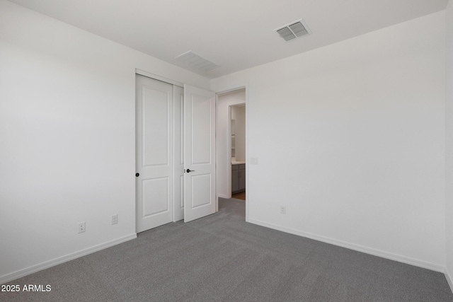 4106 W Eli Dr, San Tan Valley, AZ 85144 - unfurnished bedroom with carpet, visible vents, a closet, and baseboards