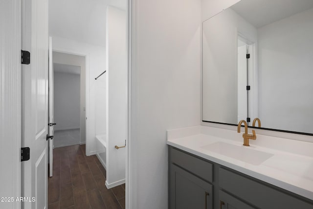 4106 W Eli Dr, San Tan Valley, AZ 85144 - full bathroom featuring washtub / shower combination, baseboards, wood finished floors, and vanity