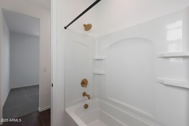 4106 W Eli Dr, San Tan Valley, AZ 85144 - bathroom with bathtub / shower combination, baseboards, and wood finished floors