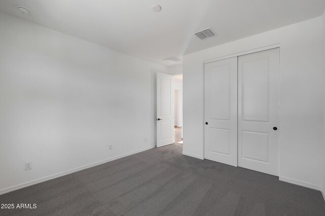 4106 W Eli Dr, San Tan Valley, AZ 85144 - unfurnished bedroom featuring dark colored carpet, a closet, baseboards, and visible vents