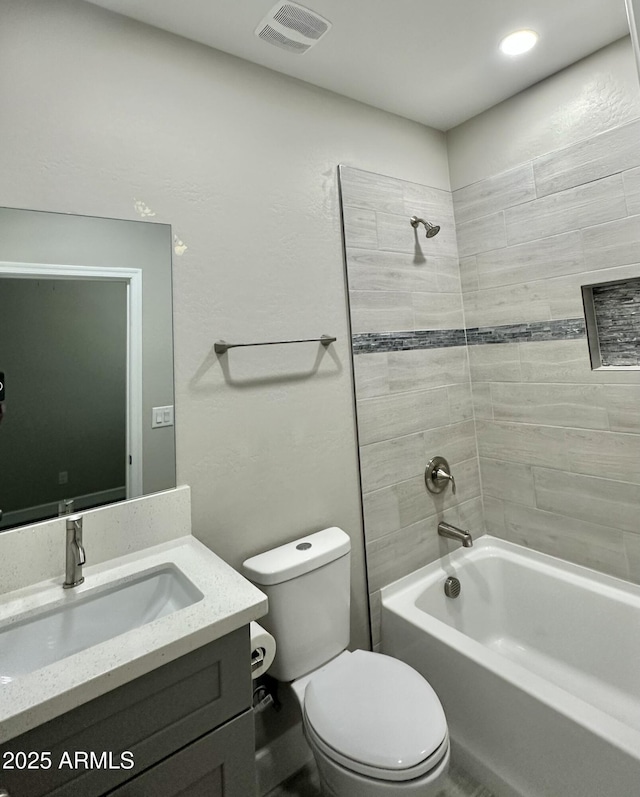 full bathroom with toilet, visible vents, tub / shower combination, and vanity