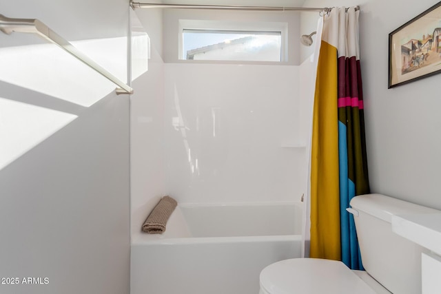 bathroom with shower / bath combo and toilet