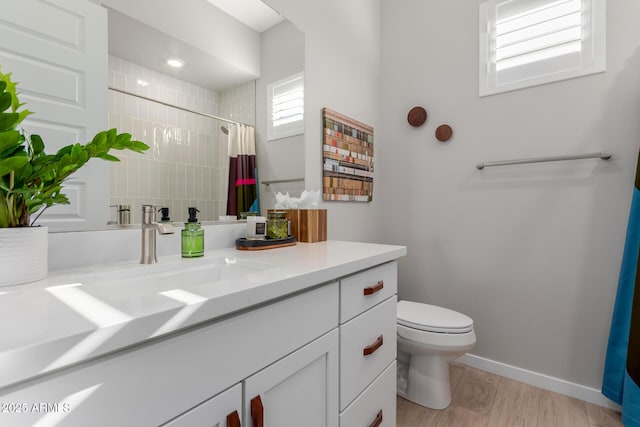 bathroom with vanity, hardwood / wood-style flooring, toilet, and a shower with shower curtain