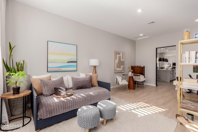 living room with light hardwood / wood-style flooring