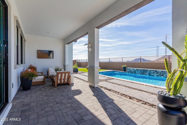 view of patio with a fenced in pool