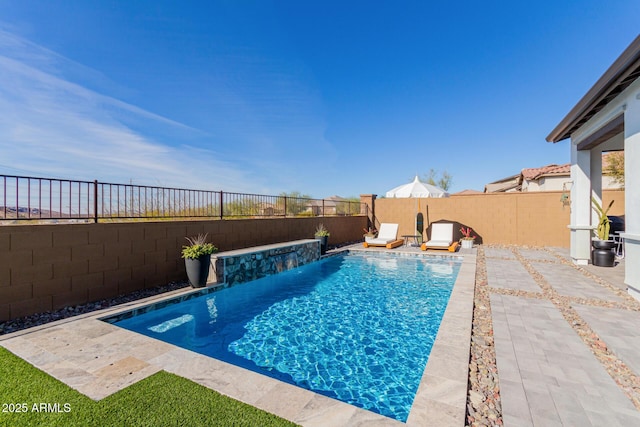 view of swimming pool featuring a patio and pool water feature