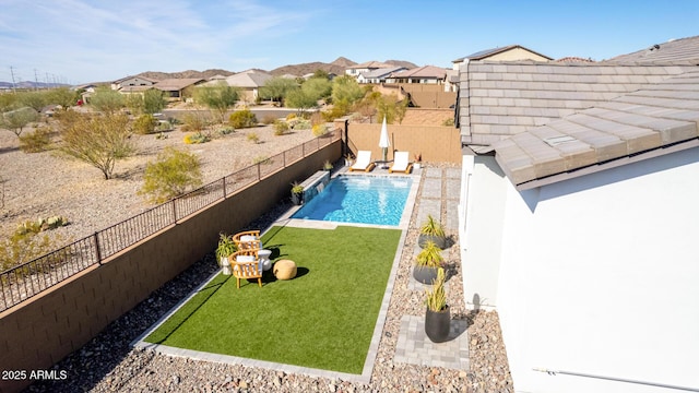 view of swimming pool with a lawn and a patio area