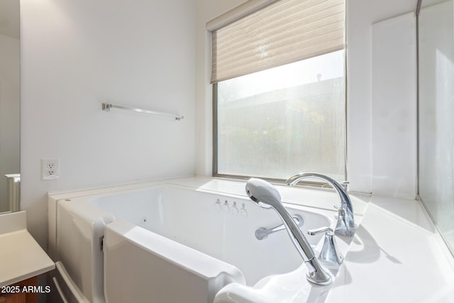 bathroom with a garden tub