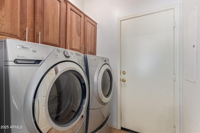 laundry area featuring cabinet space and separate washer and dryer