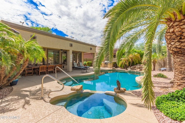 view of swimming pool featuring ceiling fan, a patio, an outdoor living space, and a pool with connected hot tub