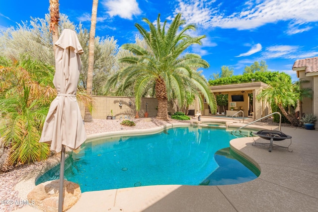 view of swimming pool with a patio area and a fenced in pool