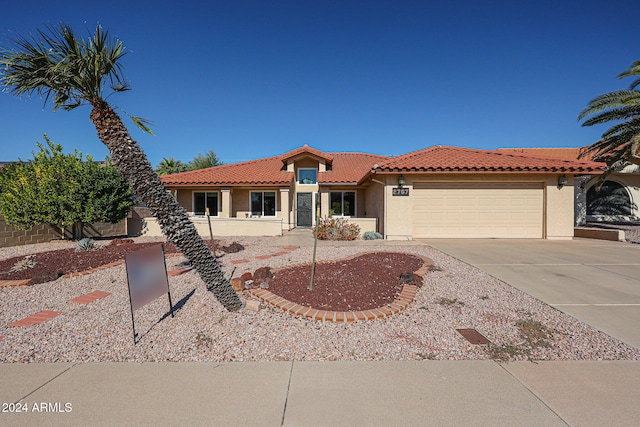 view of front of property with a garage