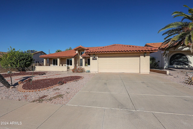 mediterranean / spanish-style house featuring a garage