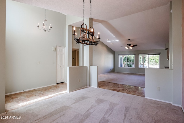 interior space featuring a textured ceiling, ceiling fan with notable chandelier, lofted ceiling, and light carpet