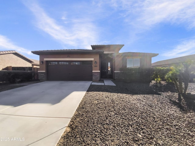 prairie-style house featuring a garage