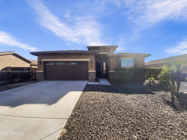 prairie-style home featuring a garage