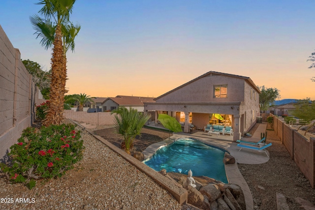 1834 W Nighthawk Way, Phoenix, AZ 85045 - pool at dusk featuring a patio area and a fenced backyard