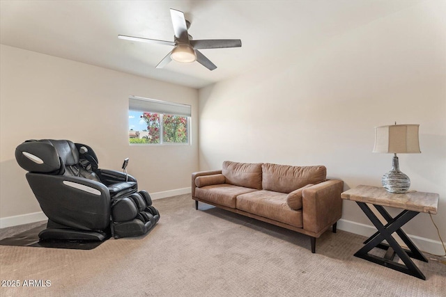 living room with baseboards, a ceiling fan, and carpet flooring